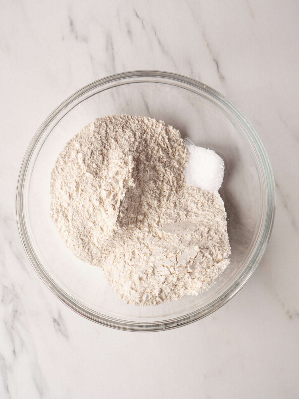 Flour and sugar in glass bowl