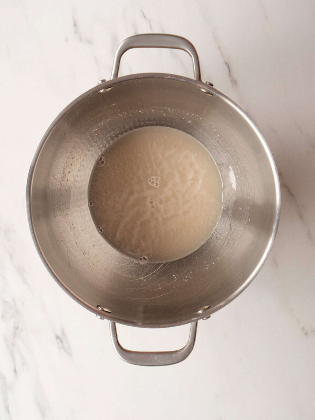 Metal bowl with liquid mixture inside