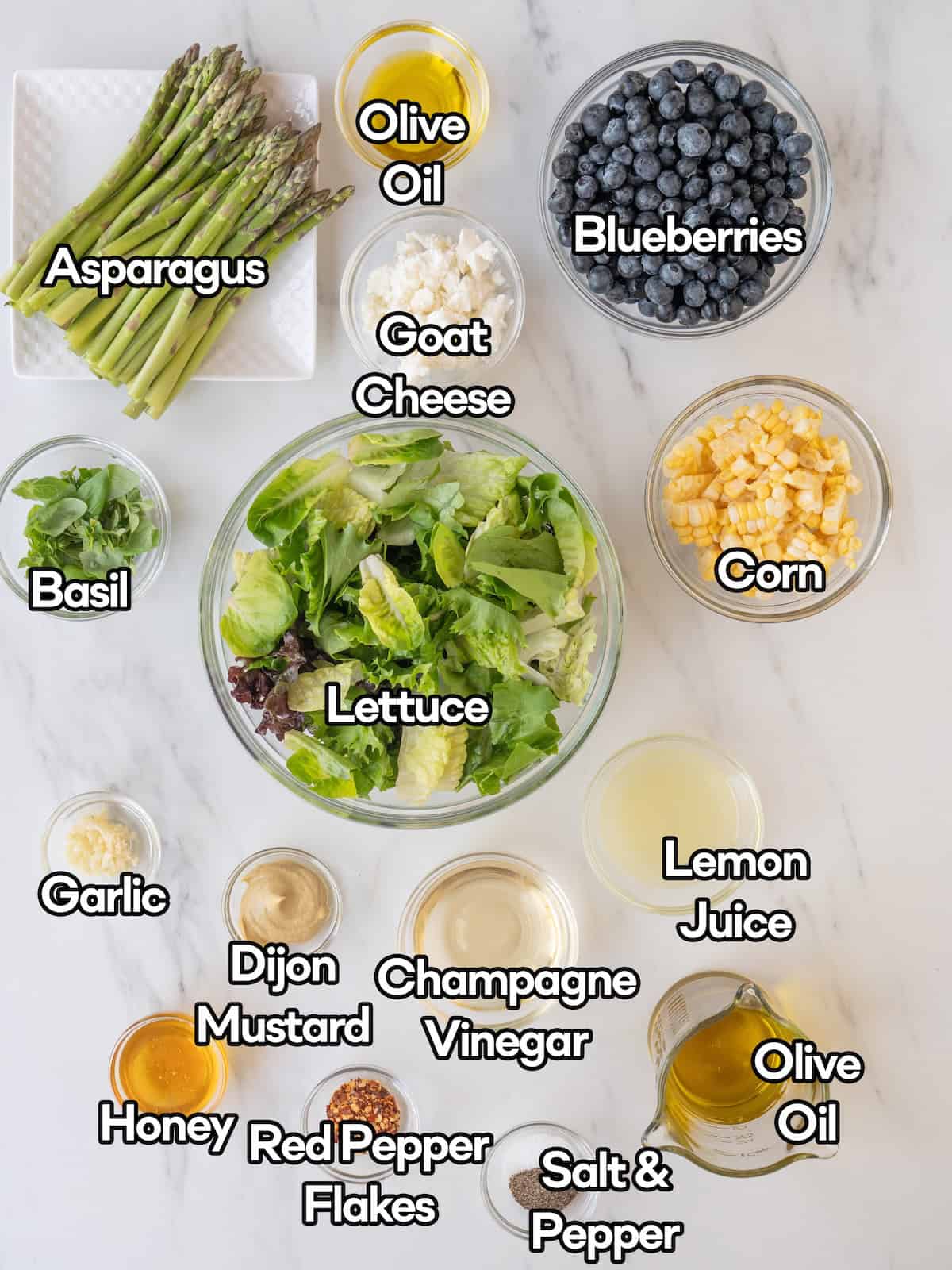 Mise en place of all ingredients to make blueberry and grilled asparagus salad.