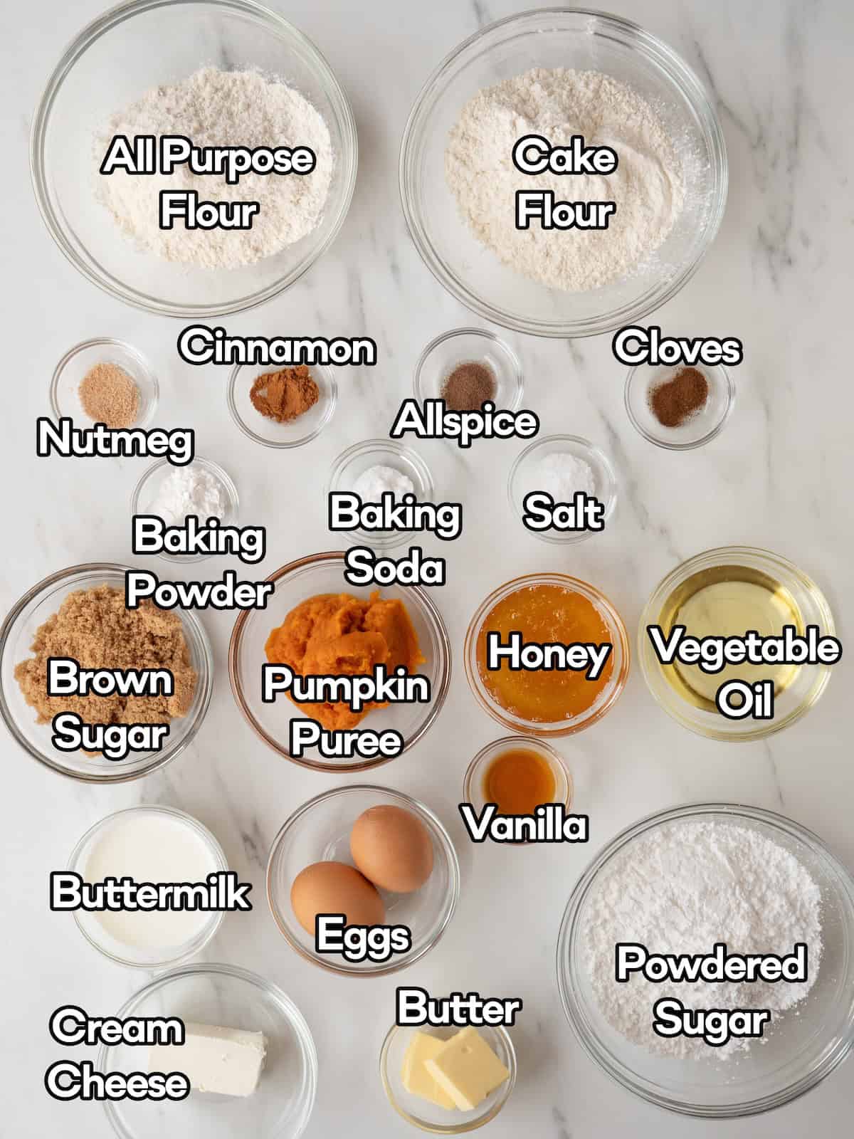 Mise en place of all ingredients to make spiced pumpkin donuts.