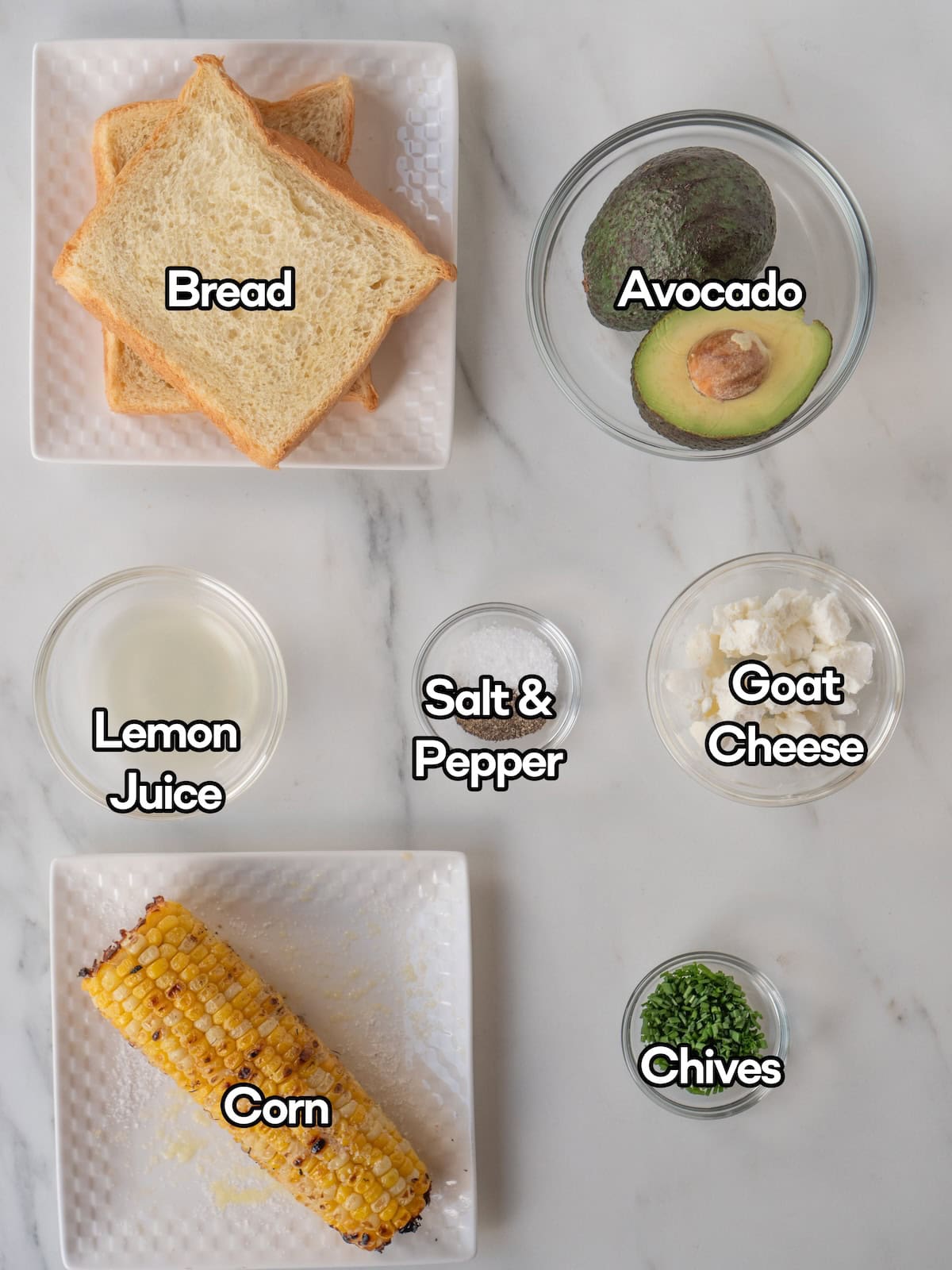 Mise en place of all ingredients to make charred corn and goat cheese avocado toast.