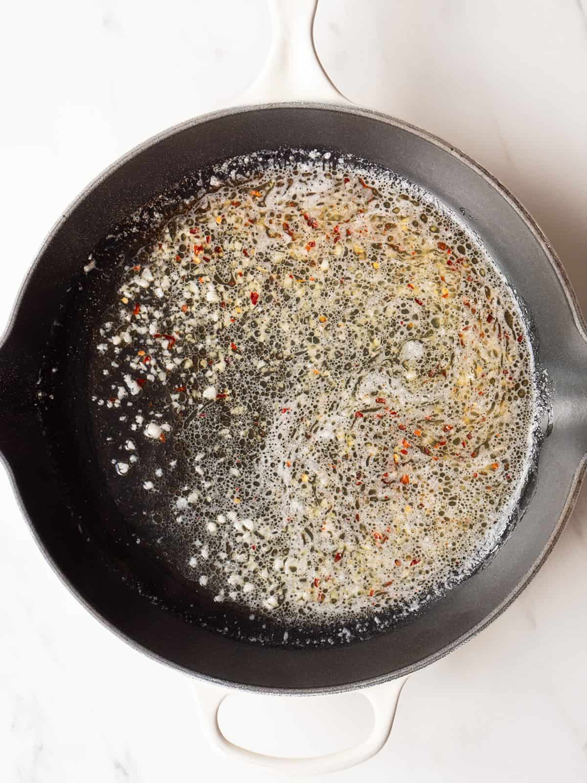 Butter and spices melting in skillet