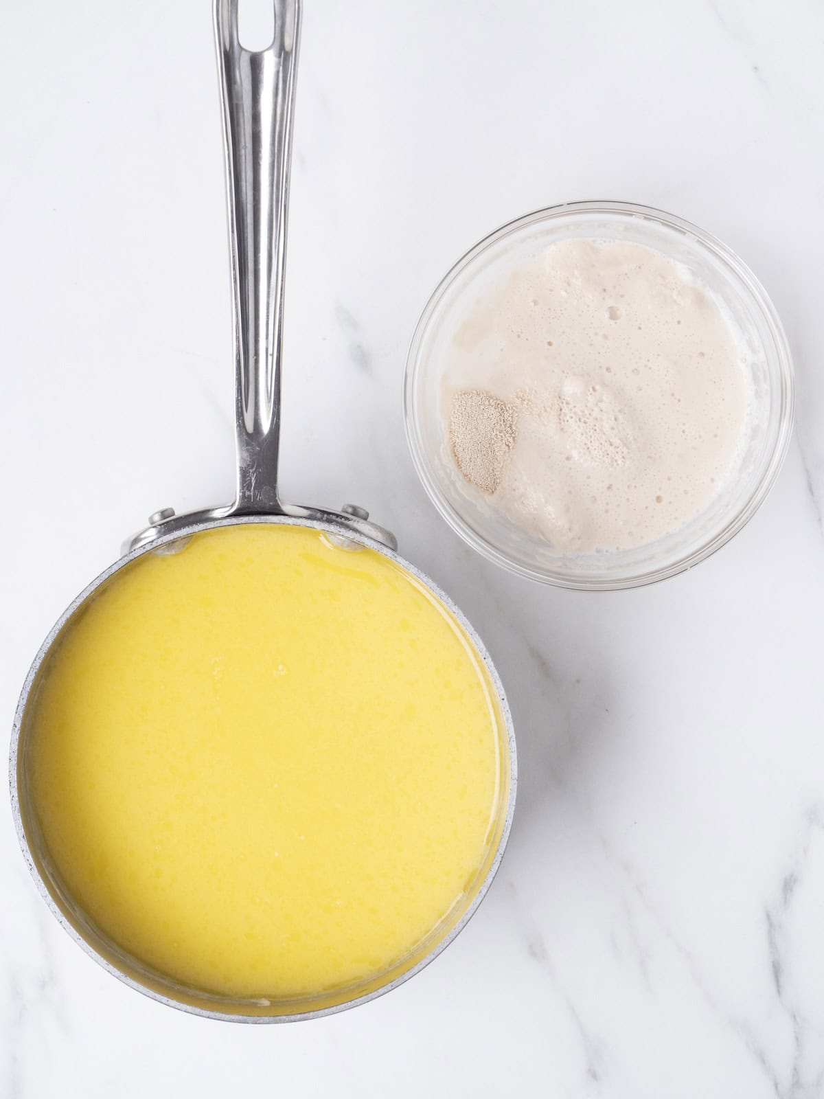 Yellow liquid and jar of yeast