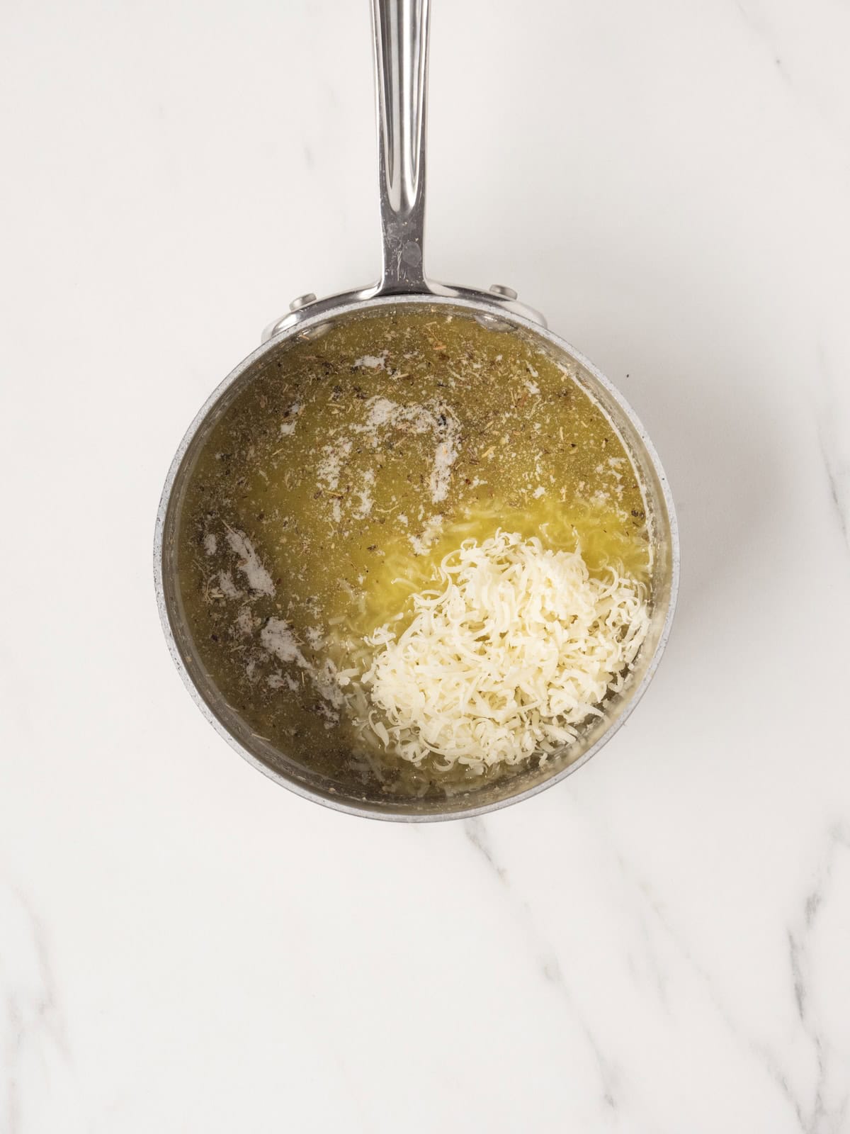 Melted butter with herbs and cheese