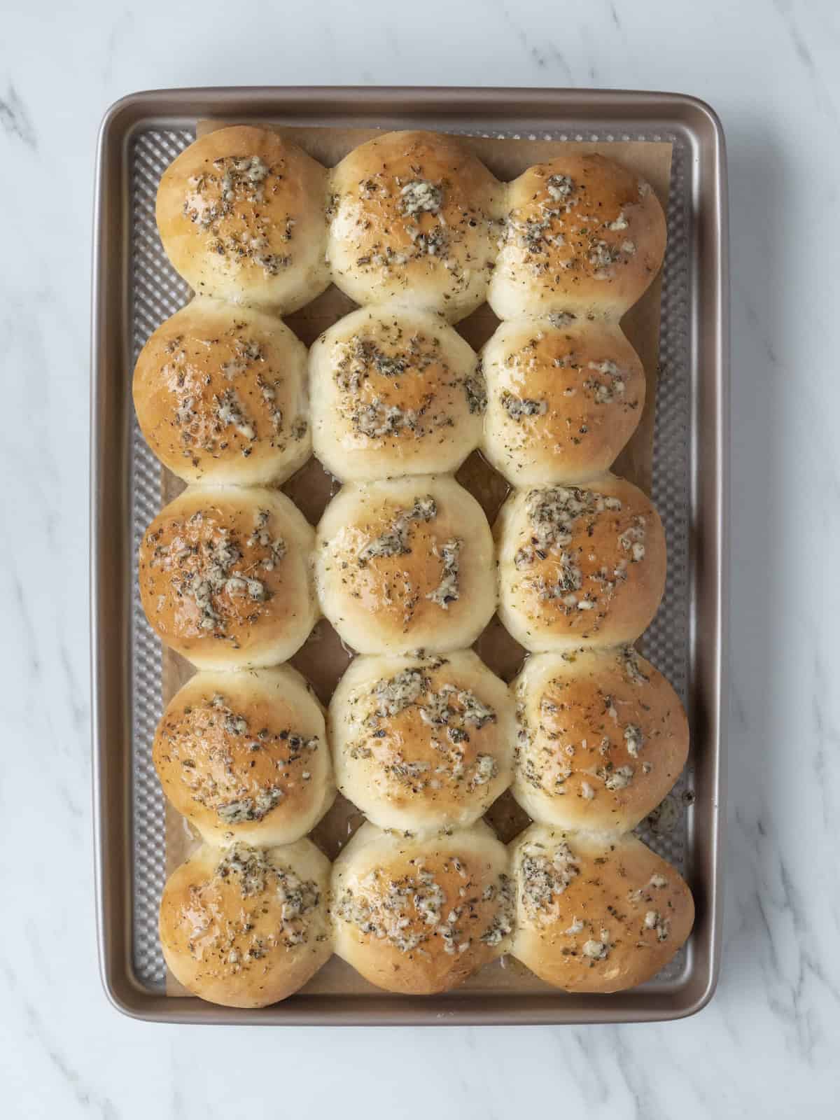 Golden brown garlic herb dinner rolls