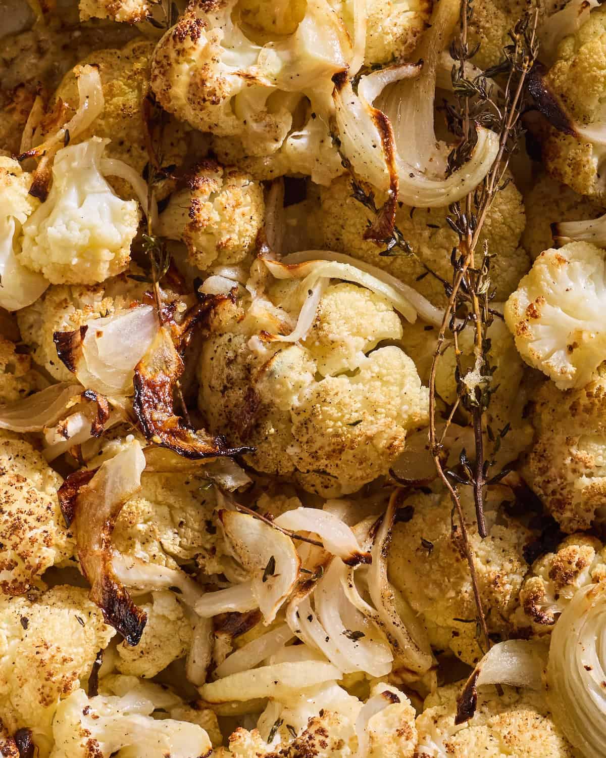 Close up of Parmesan Roasted Cauliflower with thyme and onions