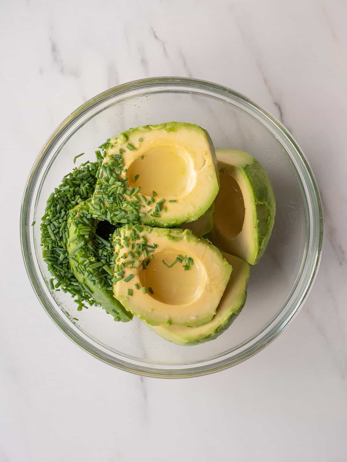 Sliced avocados with chopped chives