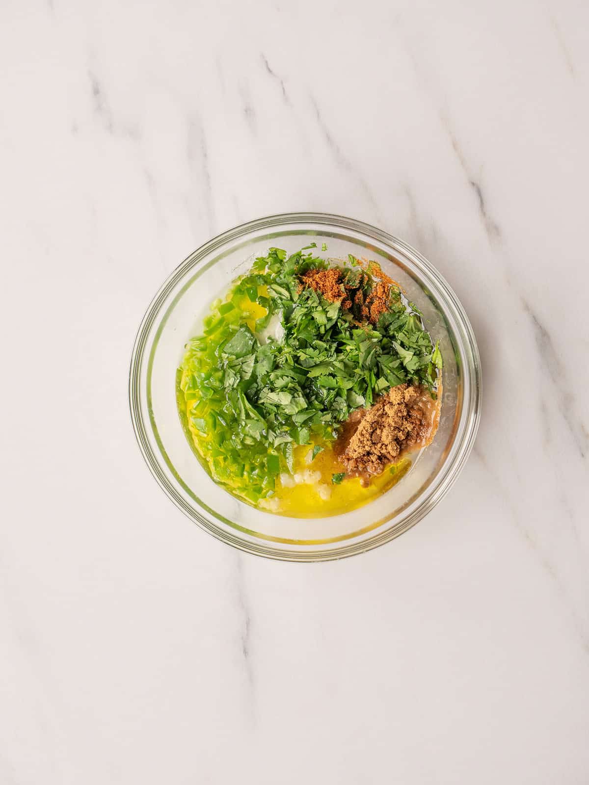 Bowl of green marinade ingredients.