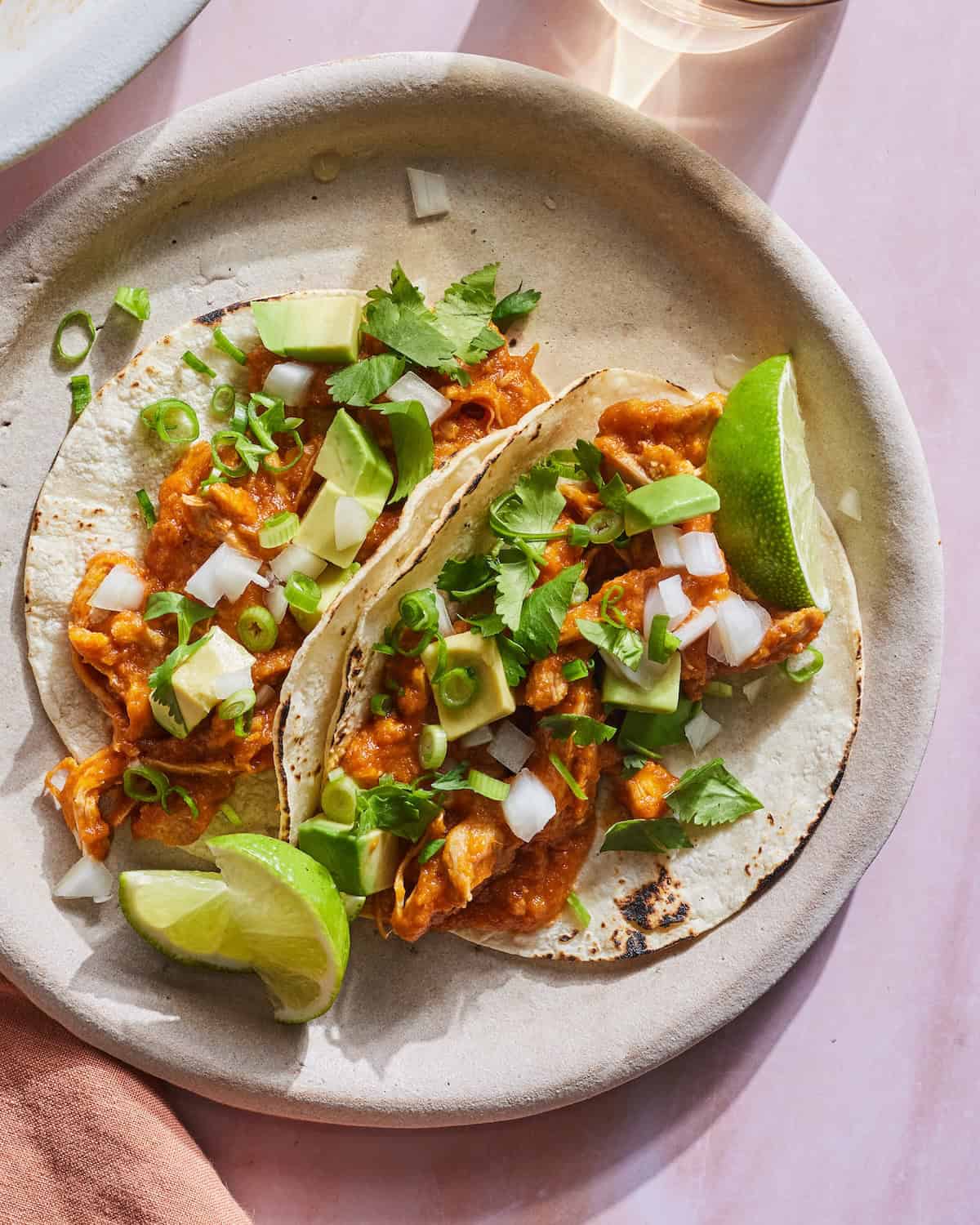 Chicken Tinga Tacos with cilantro, onions and a squeeze of lime