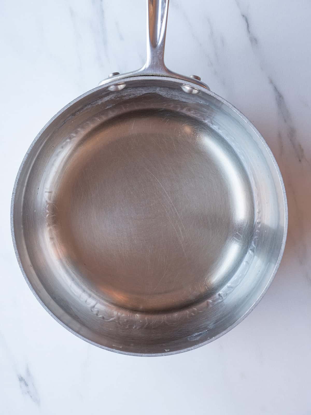 Sake and mirin simmering for Miso Marinated Black Cod