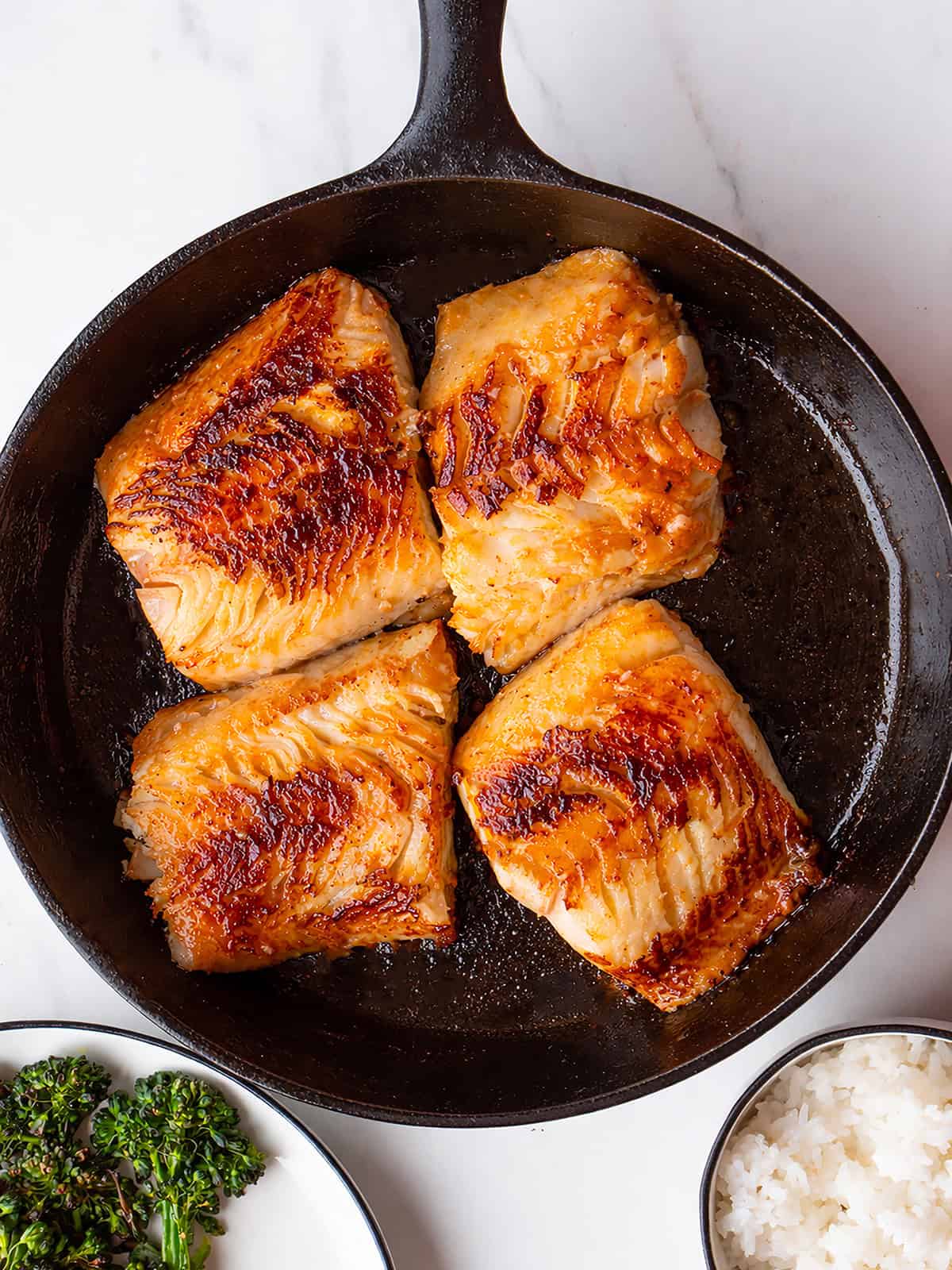 Miso Marinated Black Cod searing in an ovenproof skillet