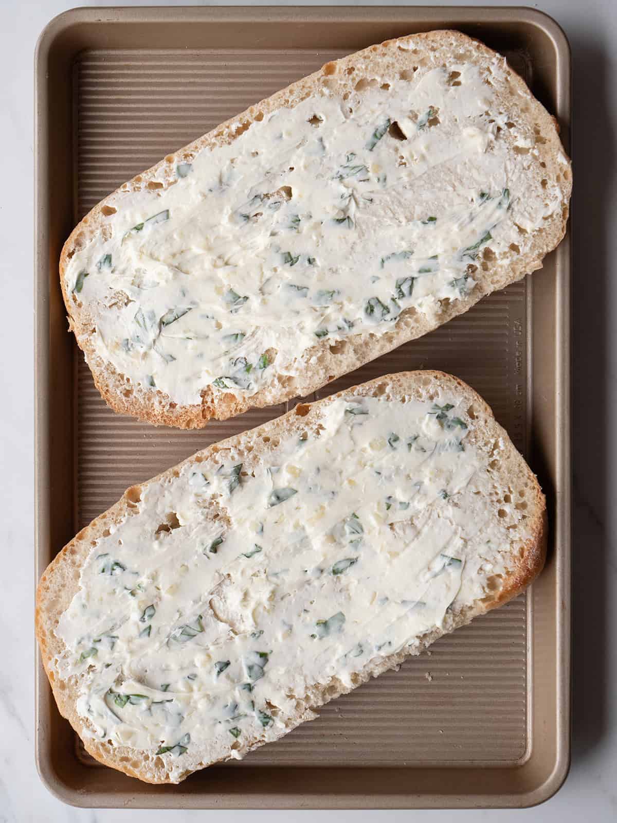 Two bread halves with spread on top
