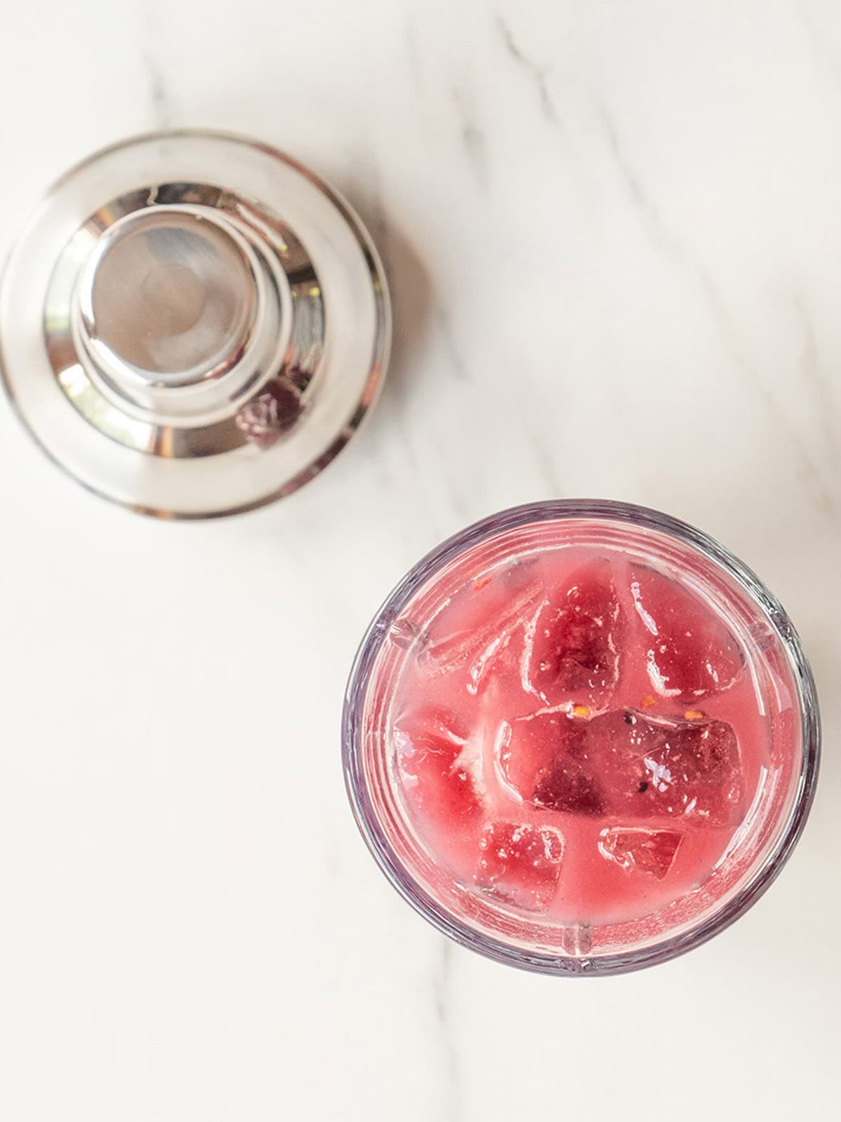 Blackberry Pineapple drink with ice and shaker