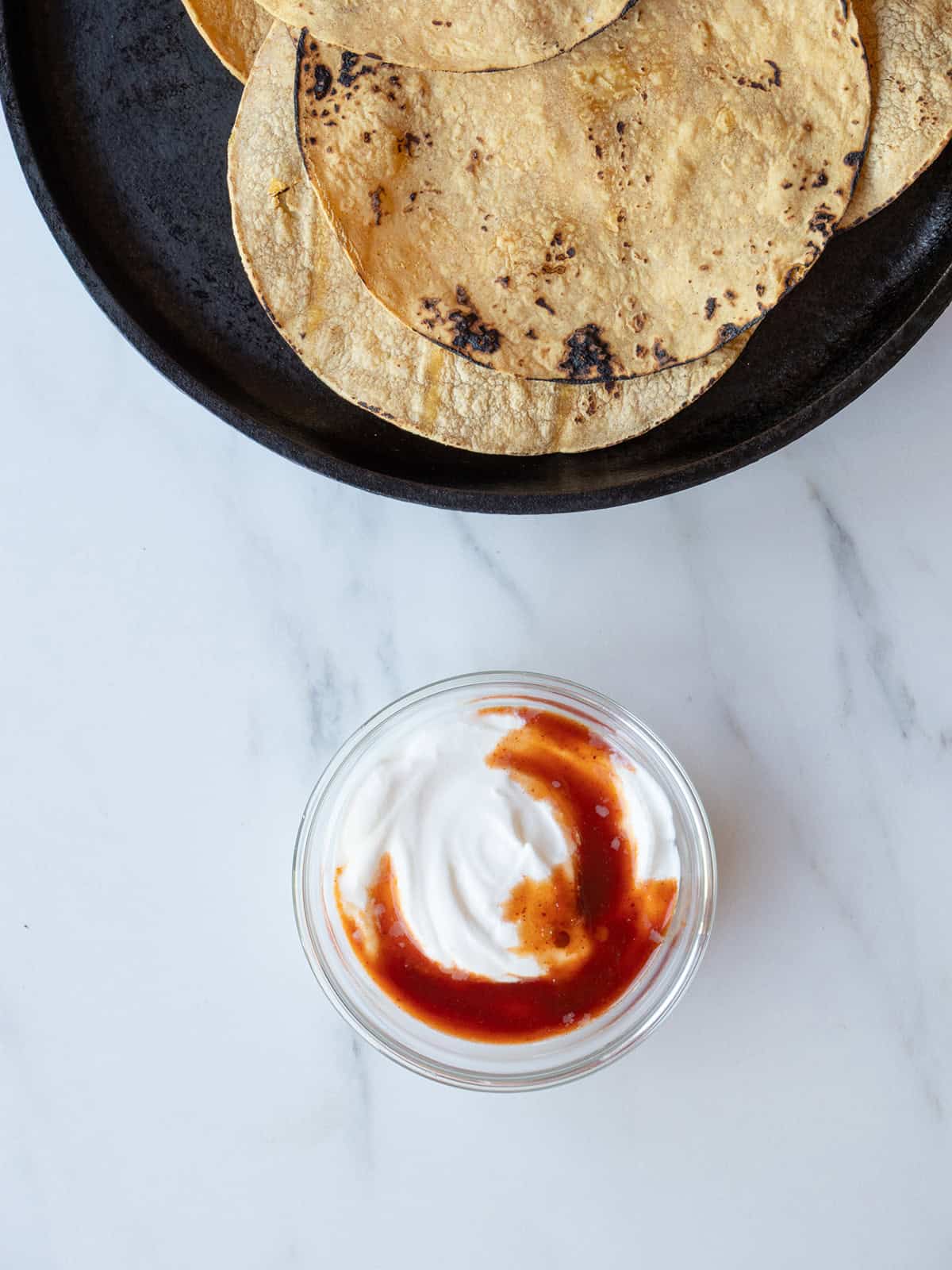 Chipotle crema and charred tortillas for salmon tacos