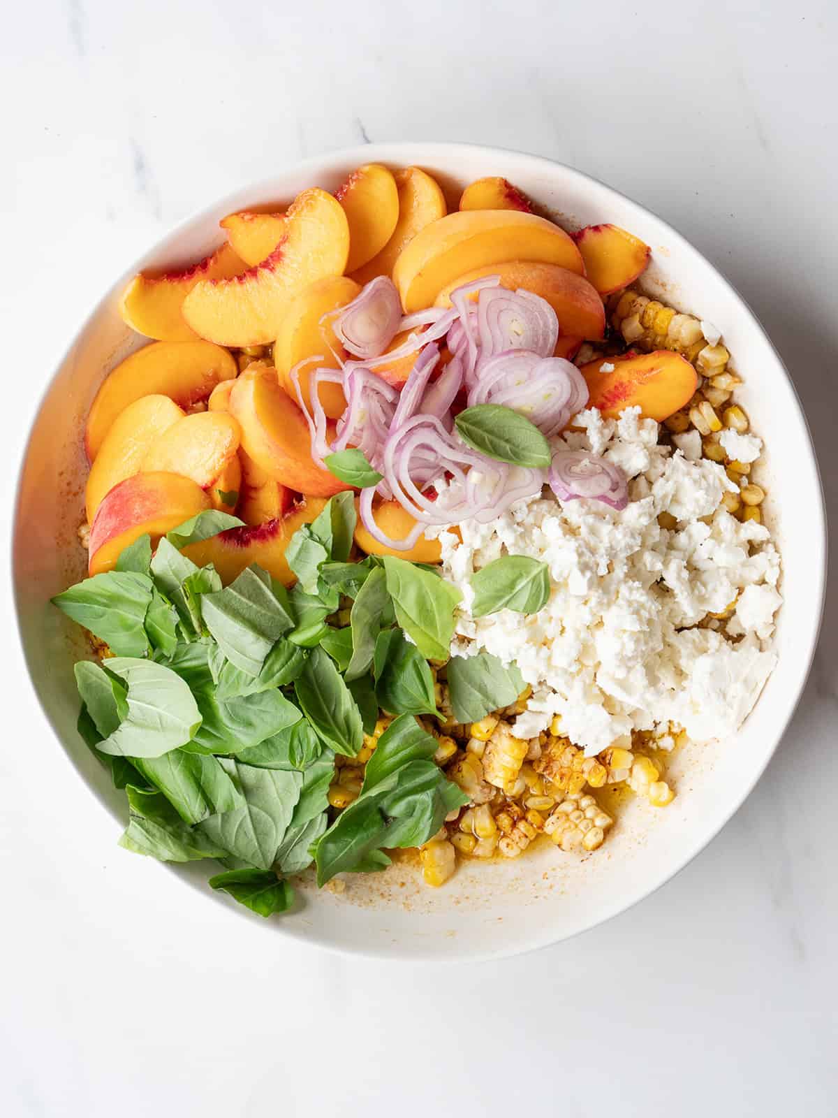 Colorful salad with corn and peaches