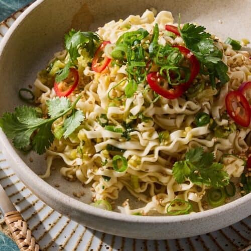Noodles topped with herbs and chilies