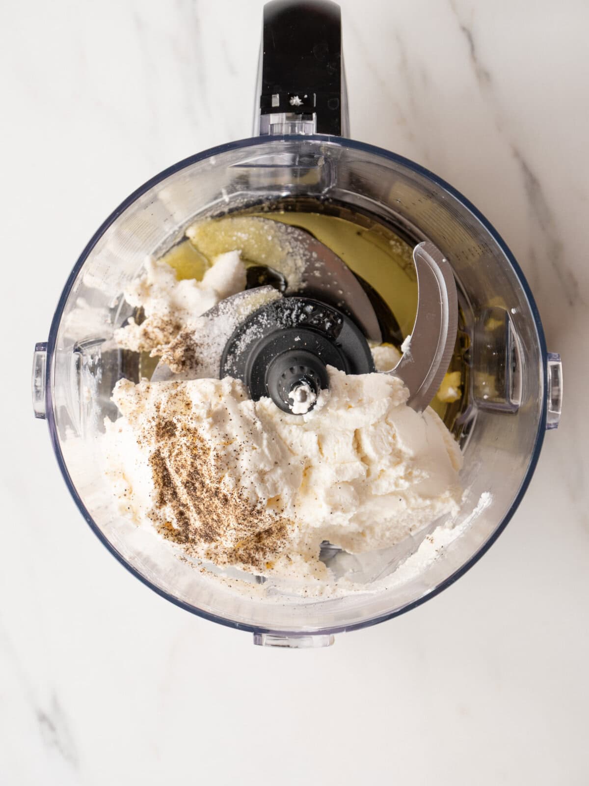 Ingredients in a food processor bowl