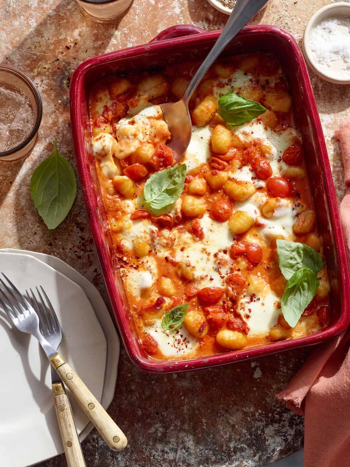 Baked gnocchi with cheese and tomatoes