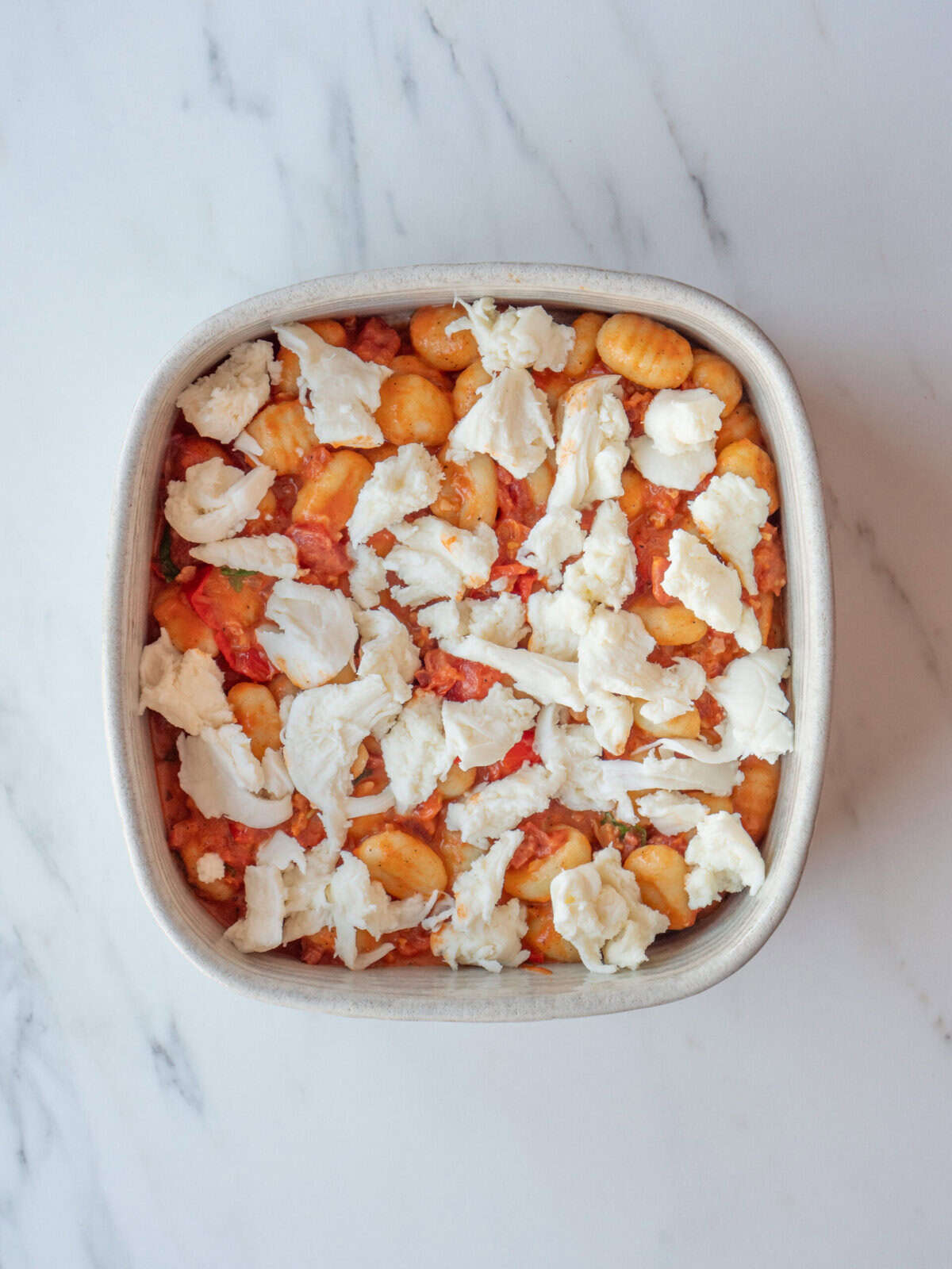 Baked gnocchi topped with cheese