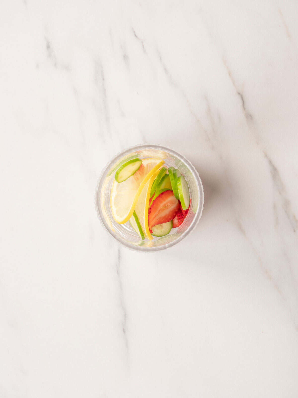Colorful drink with fruit garnishes