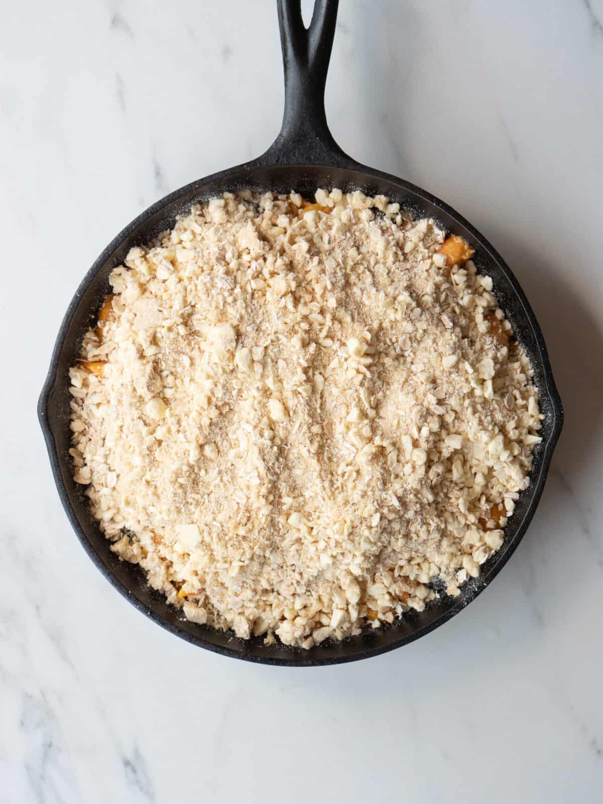 Oat topping on fruit in skillet