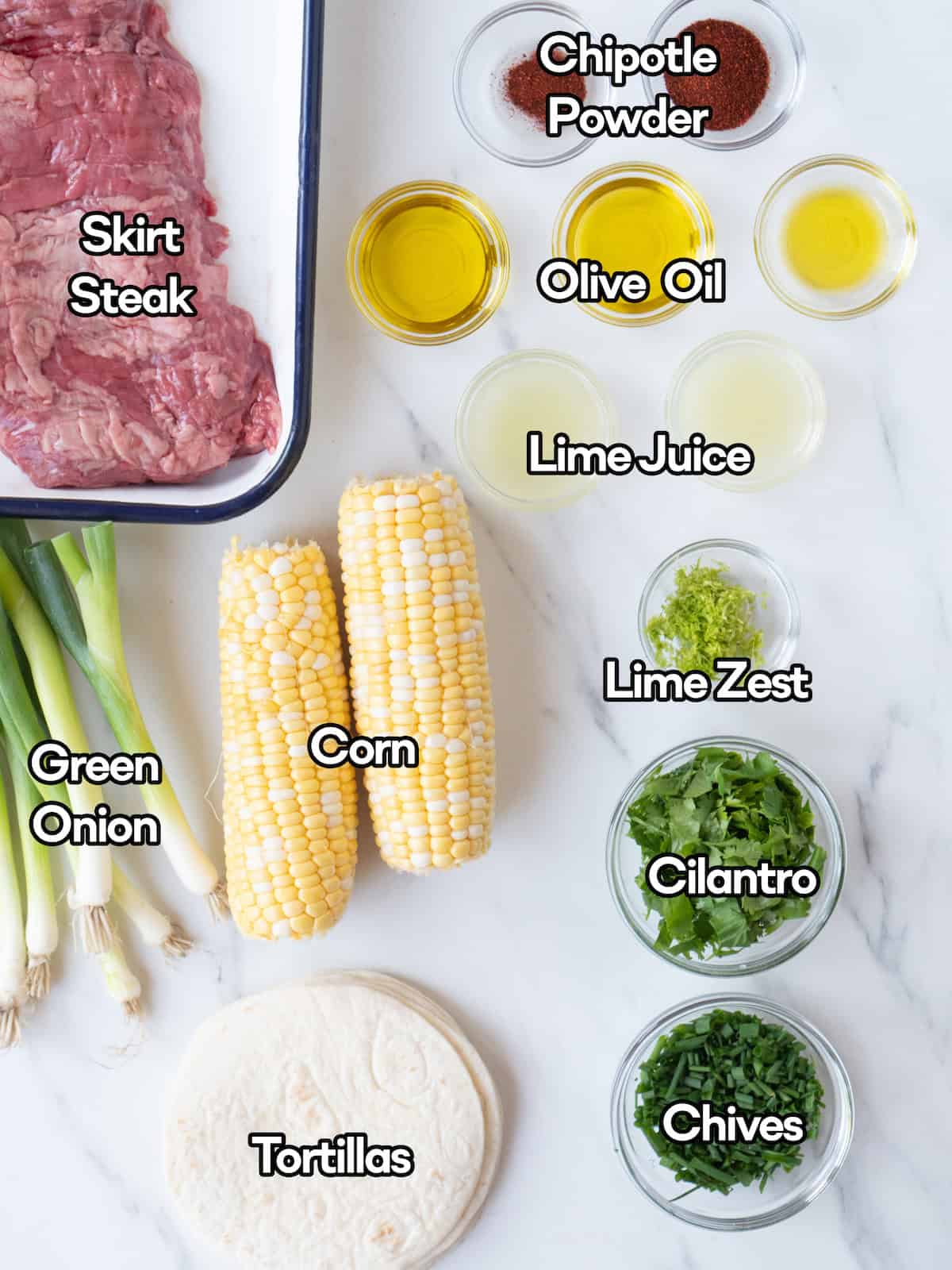 Mise en place of all ingredients to make steak tacos with corn salsa.