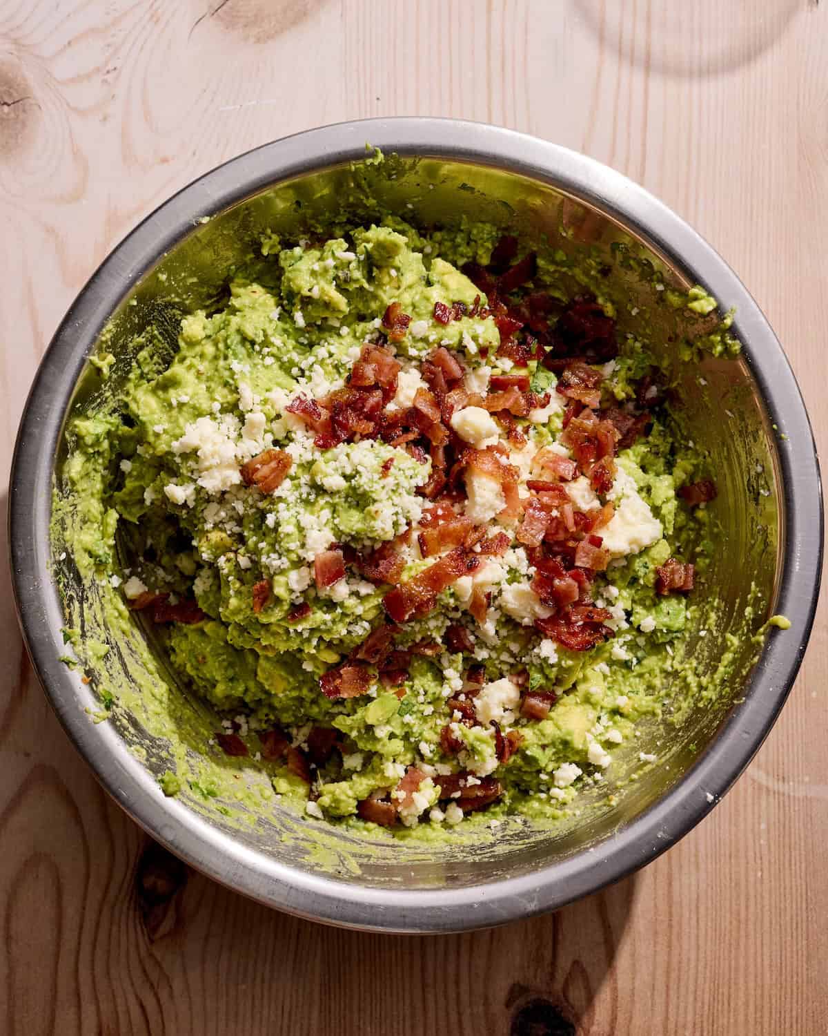 Bowl of guacamole with bacon
