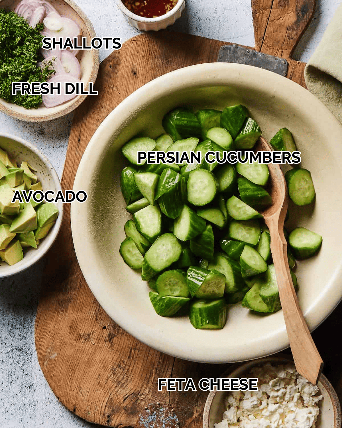 mise-en-place with all the ingredients required to make cucumber feta salad.