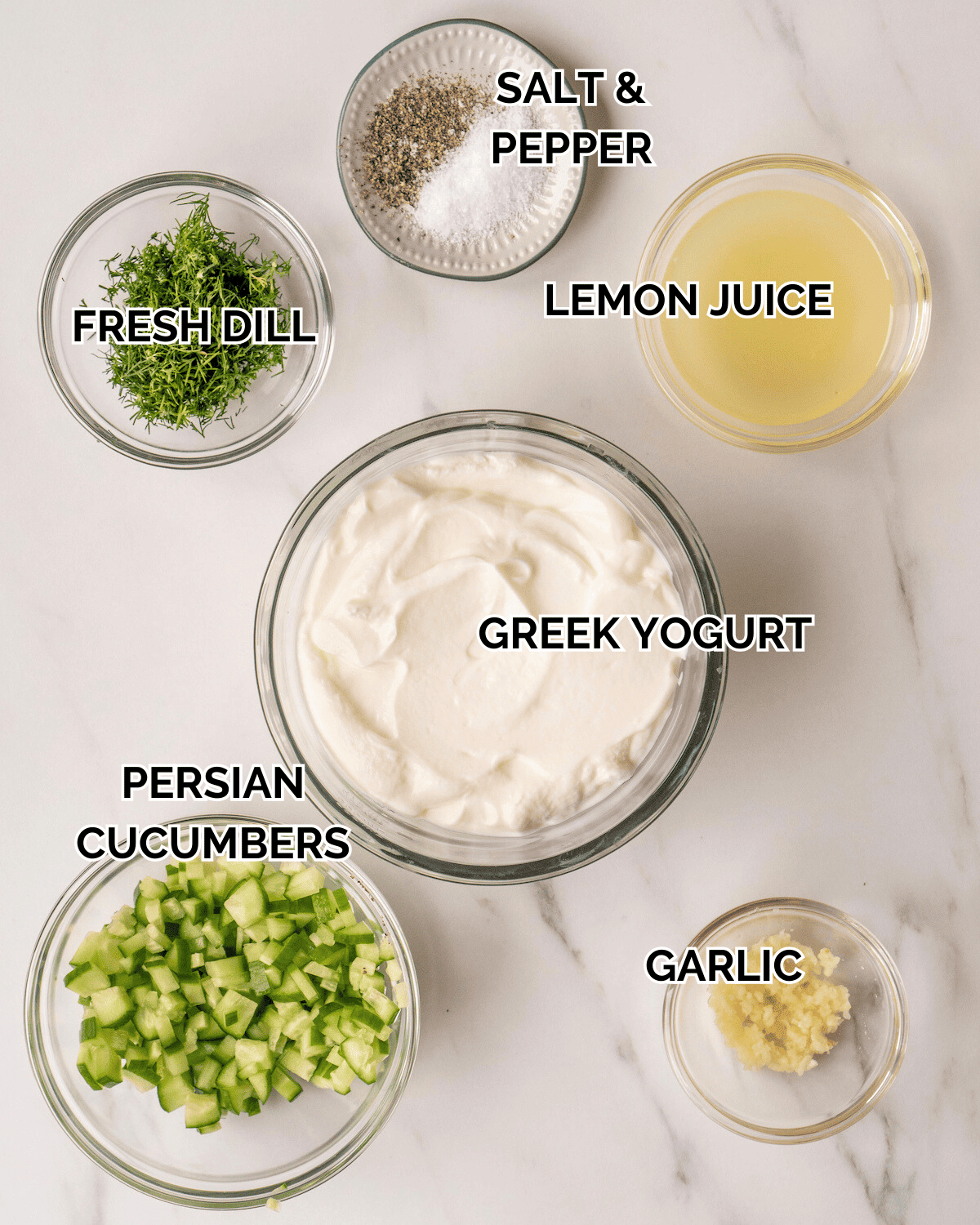 A mise-en-place with all the ingredients required to make tzatziki sauce.