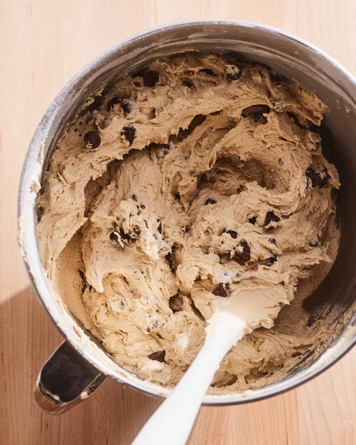 A mixing bowl full of cookie dough from The Best Chocolate Chip Cookie Recipe