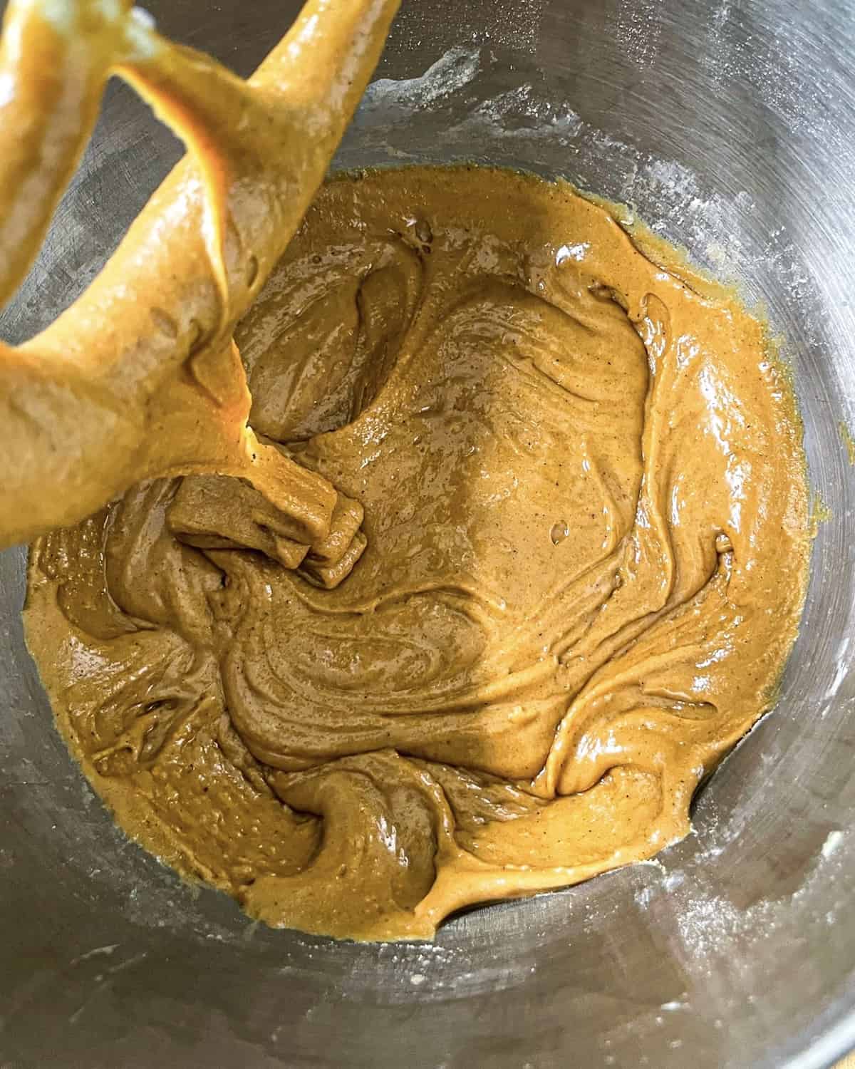 butter, sugar, egg and molasses mixed in the bowl of a stand mixer