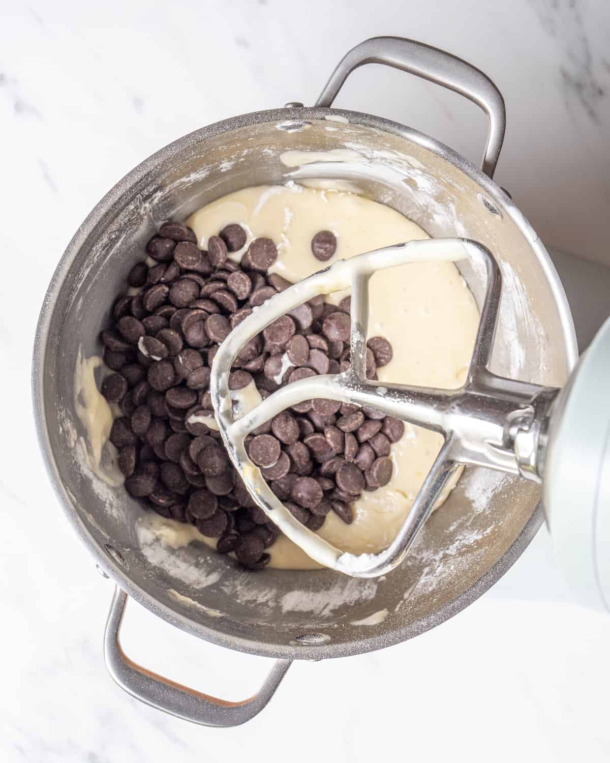 Chocolate chips has been added to all the ingredients used up to this point in the stand mixer.  