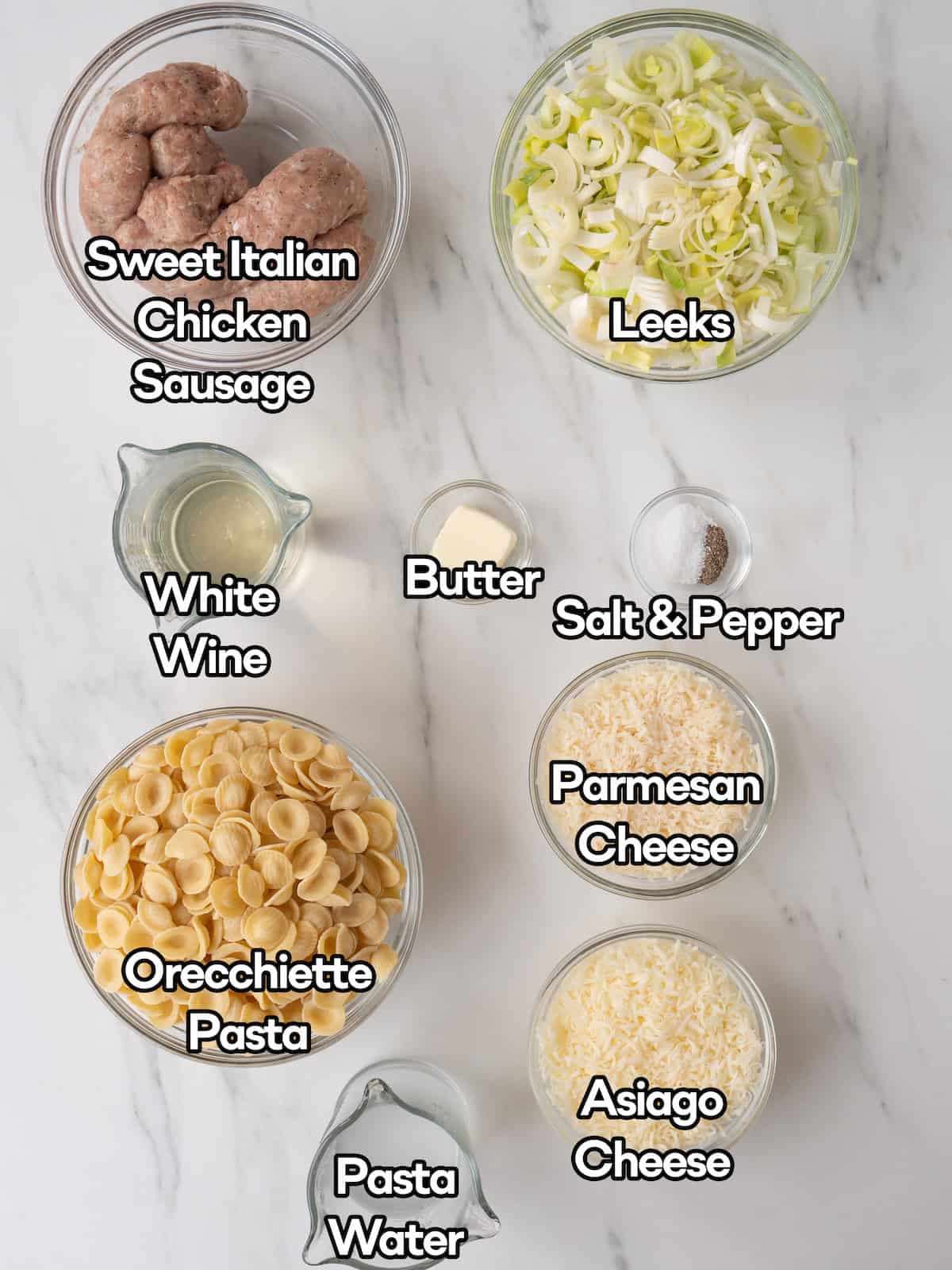 Mise en place of all ingredients to make sausage and leek orecchiette.