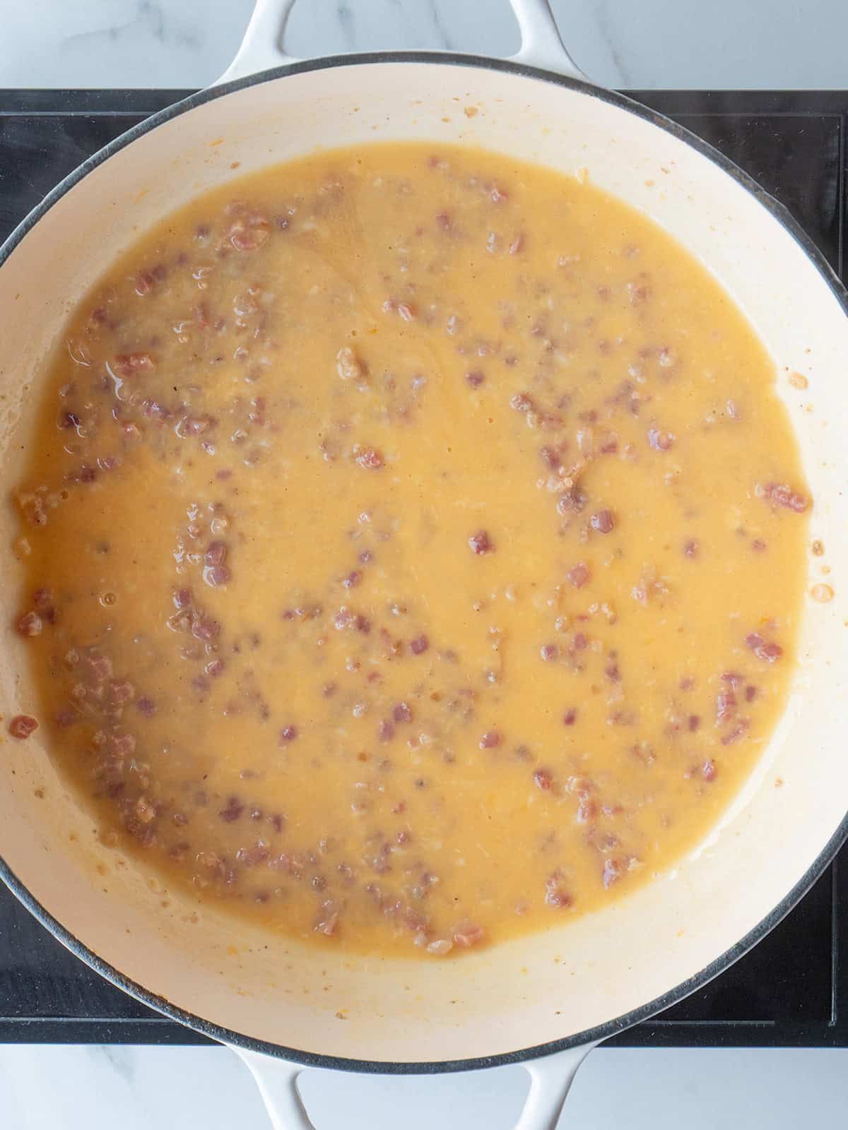 Creamy sauce with bits of pancetta