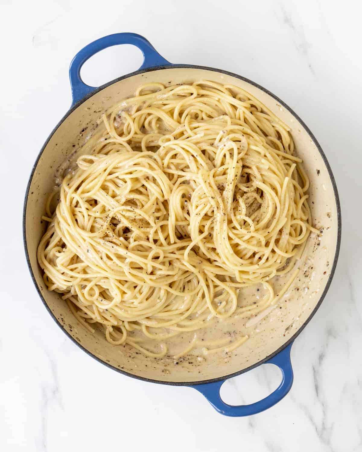 The final prepped dish of cacio e pepe in a large skillet.  