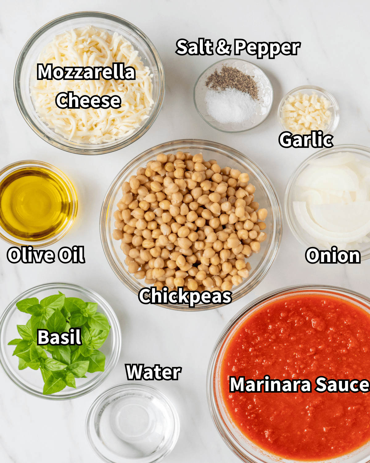 Skillet cheesy chickpeas recipe visual ingredients such as mozzarella cheese, basil, olive oil, garlic, salt & pepper, chickpeas, marinara sauce, water, and onion