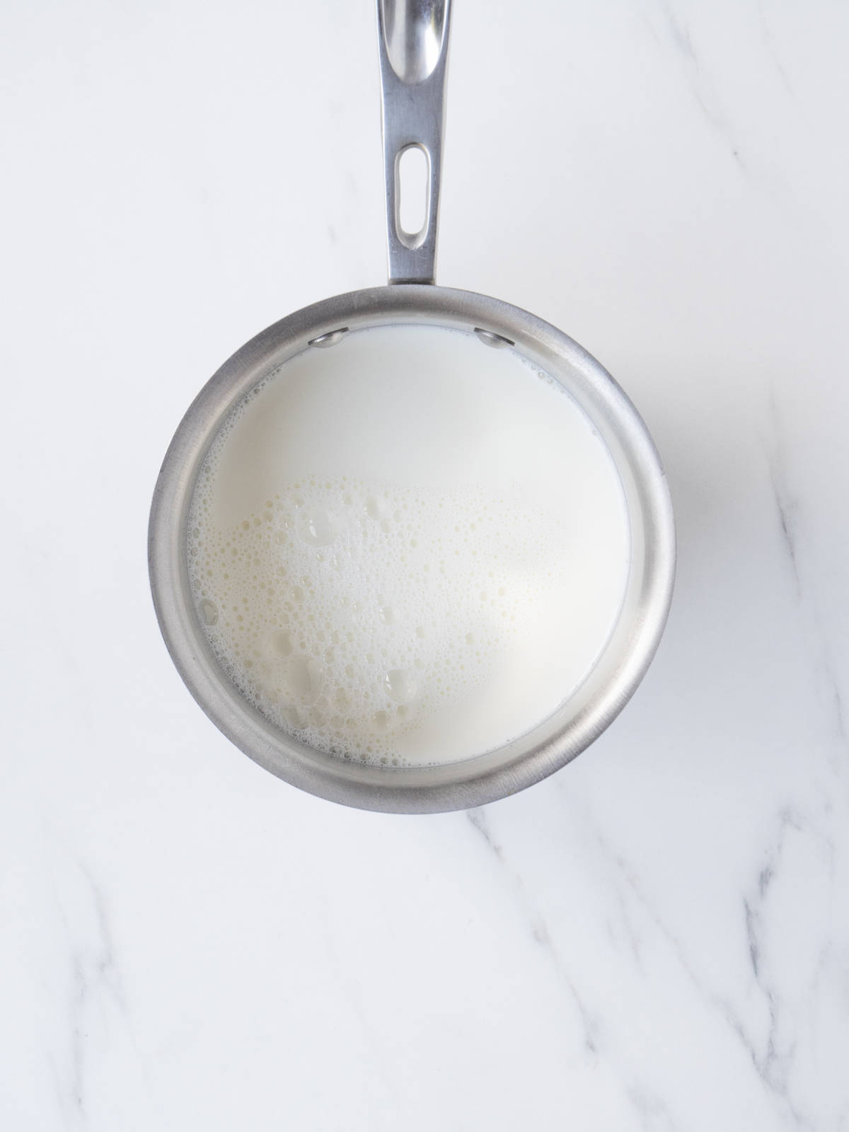 A small saucepan with milk.