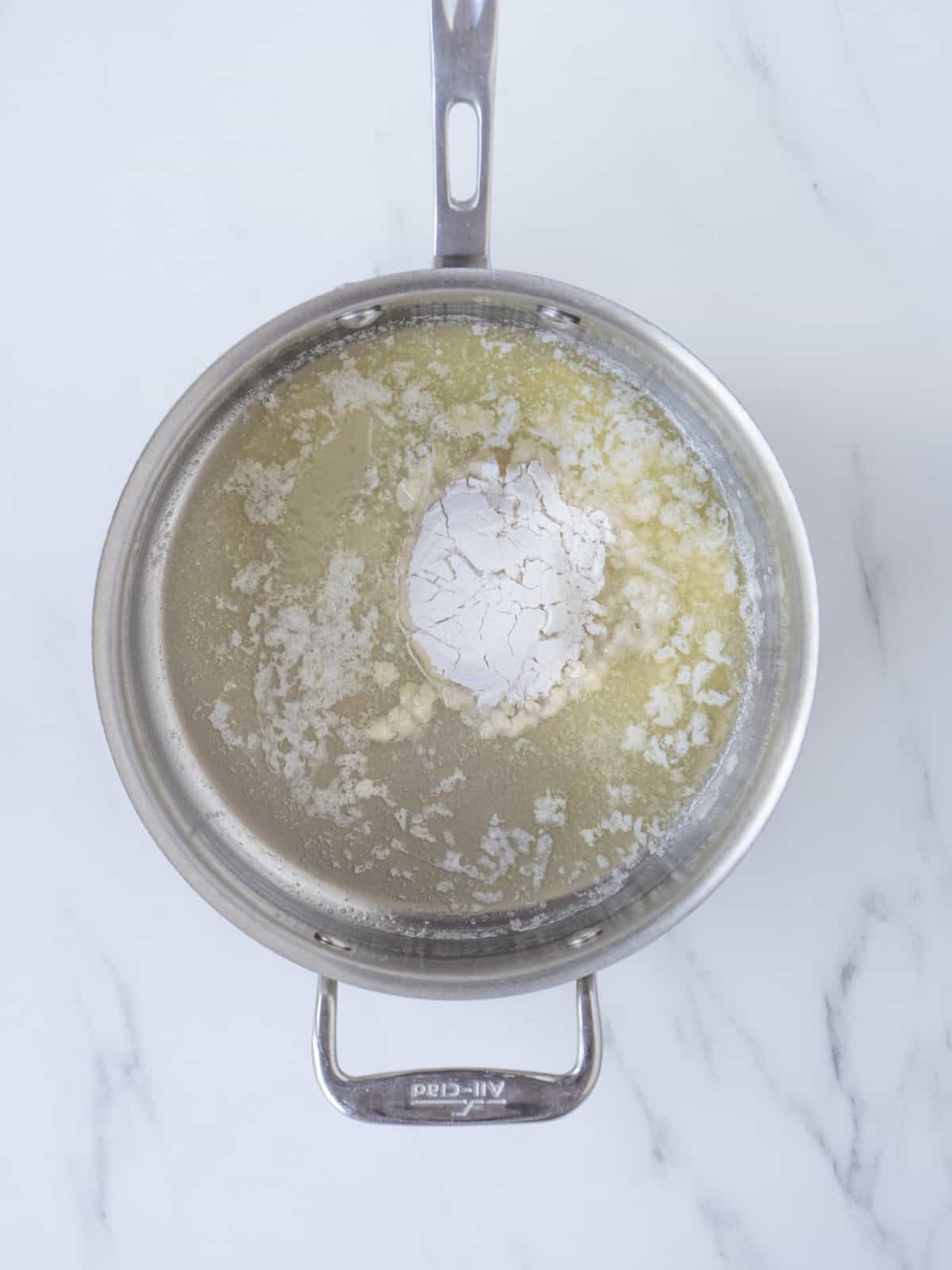 A saucepan with melted butter and salt.