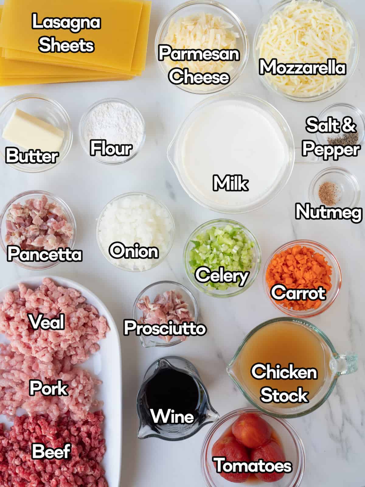 A mise-en-place with all the ingredients required to make three meat lasagna.