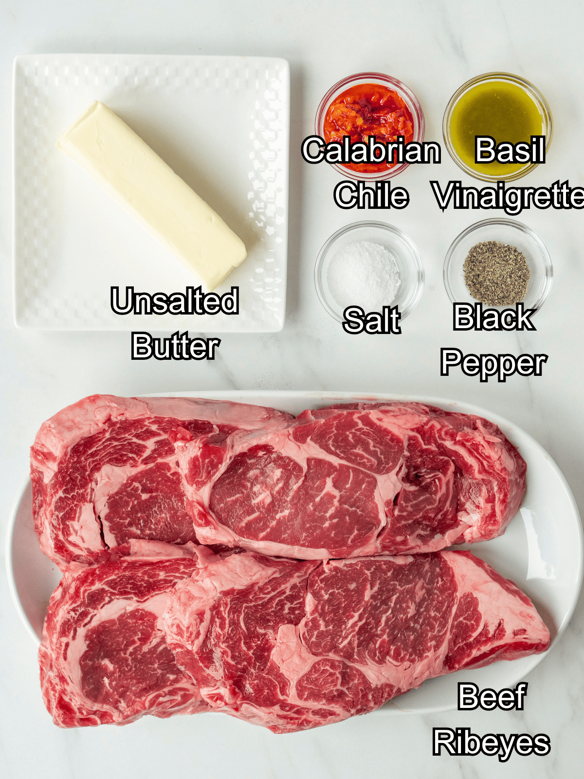 Mise-en-place with all the ingredients required to make grilled ribeyes with calabrian chile butter.
