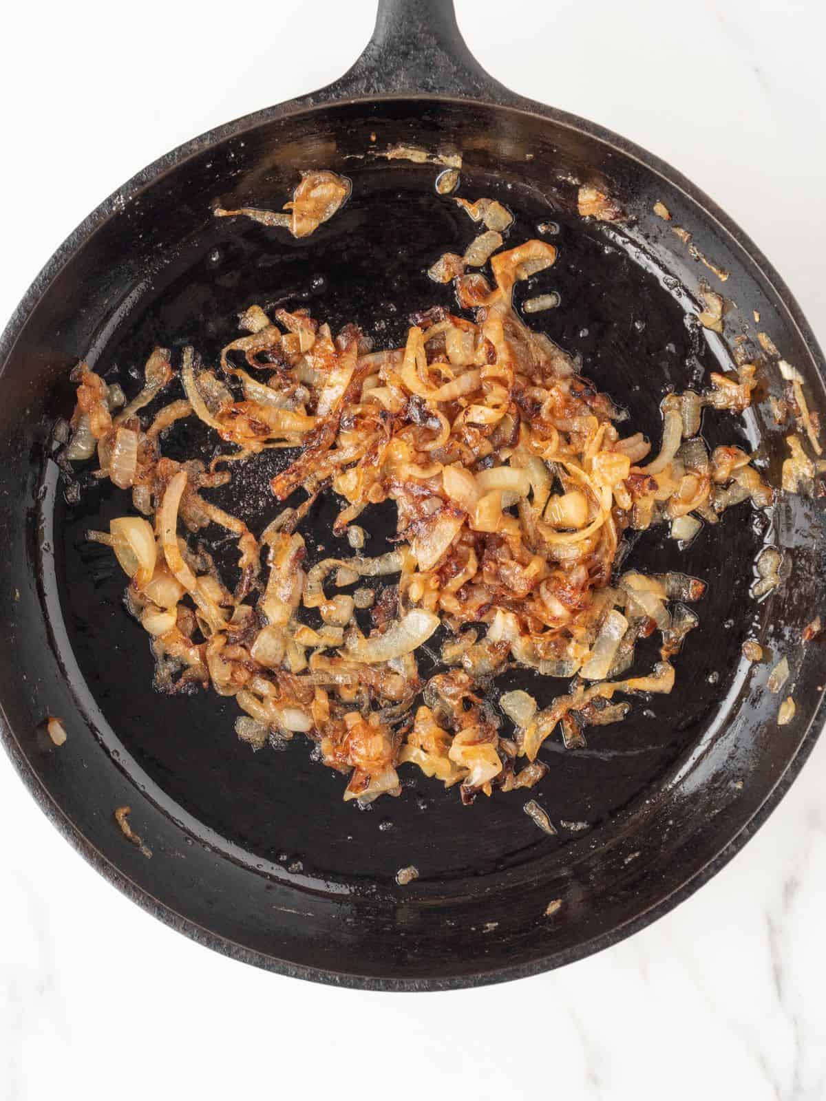 A skillet with caramelized onions.
