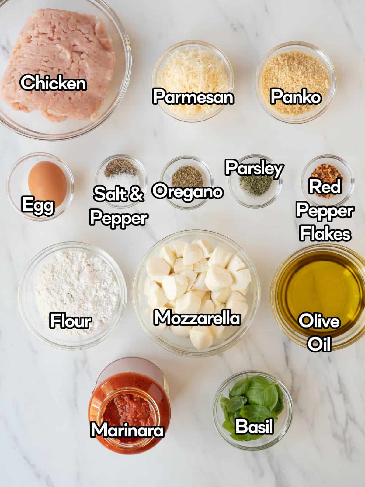 A mise-en-place of all the ingredients to make chicken parm meatballs.