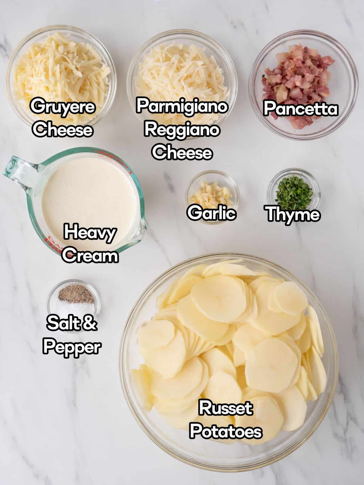 A mise-en-place of all the ingredients required to make hasselback scalloped potatoes.