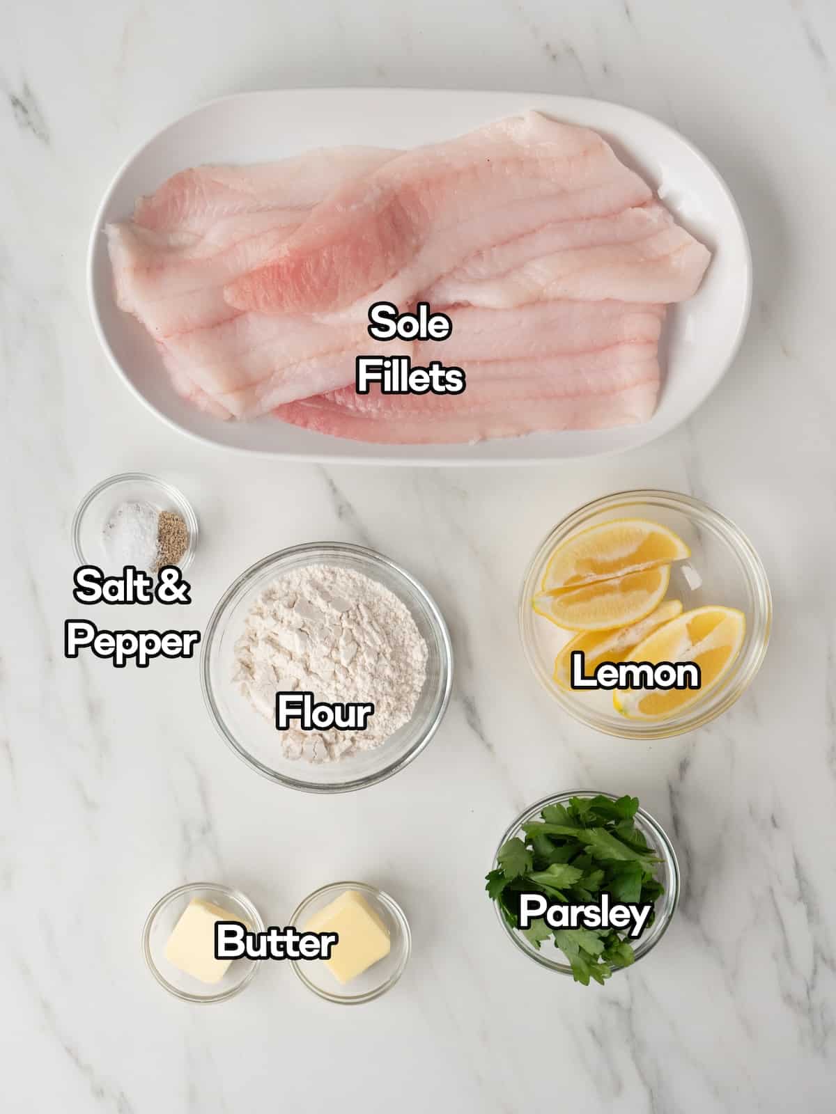 Mise-en-place of all the ingredients required to make pan fried sole with lemon.