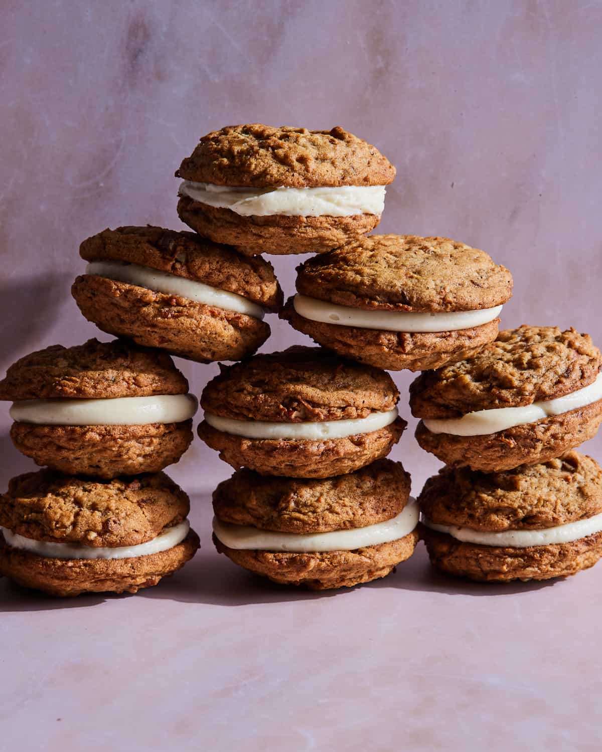 Carrot Cake Sandwich Cookies with Maple Bourbon Cream Cheese Frosting