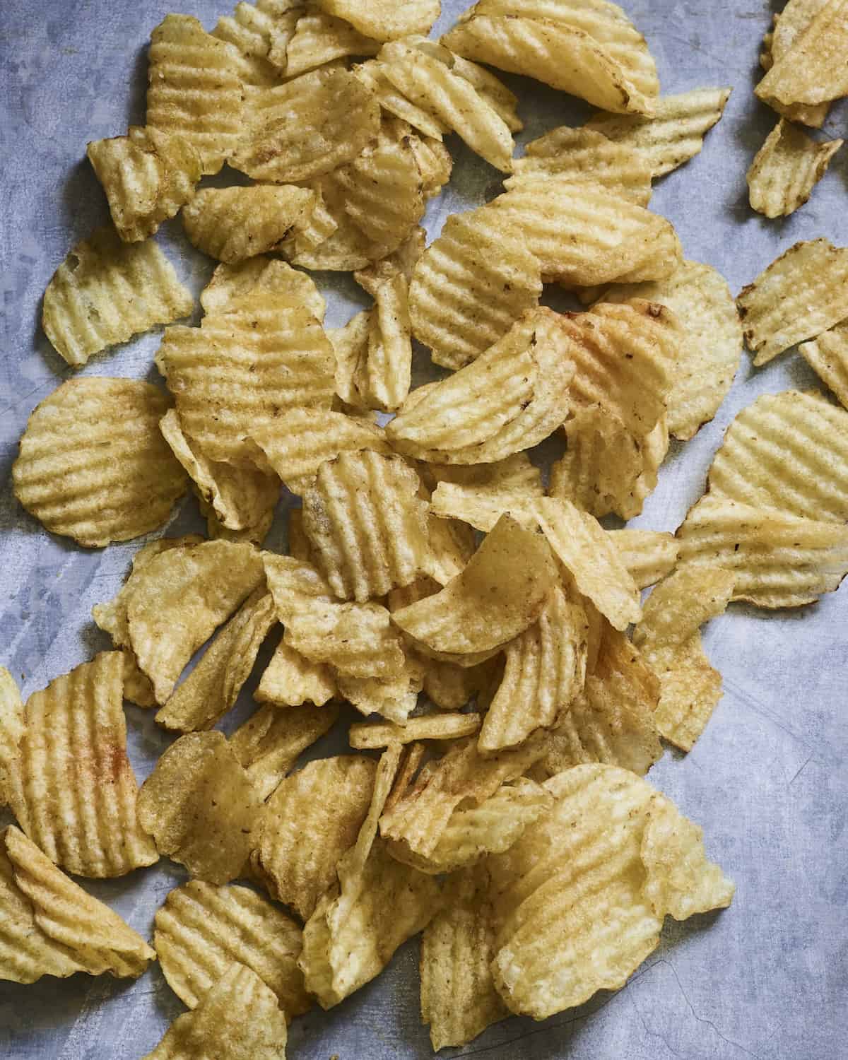 A close-up shot of wavy potato chips.