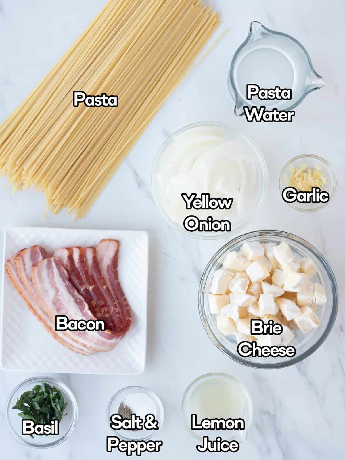 Mise-en-place of all the ingredients to make brie, bacon and basil pasta.