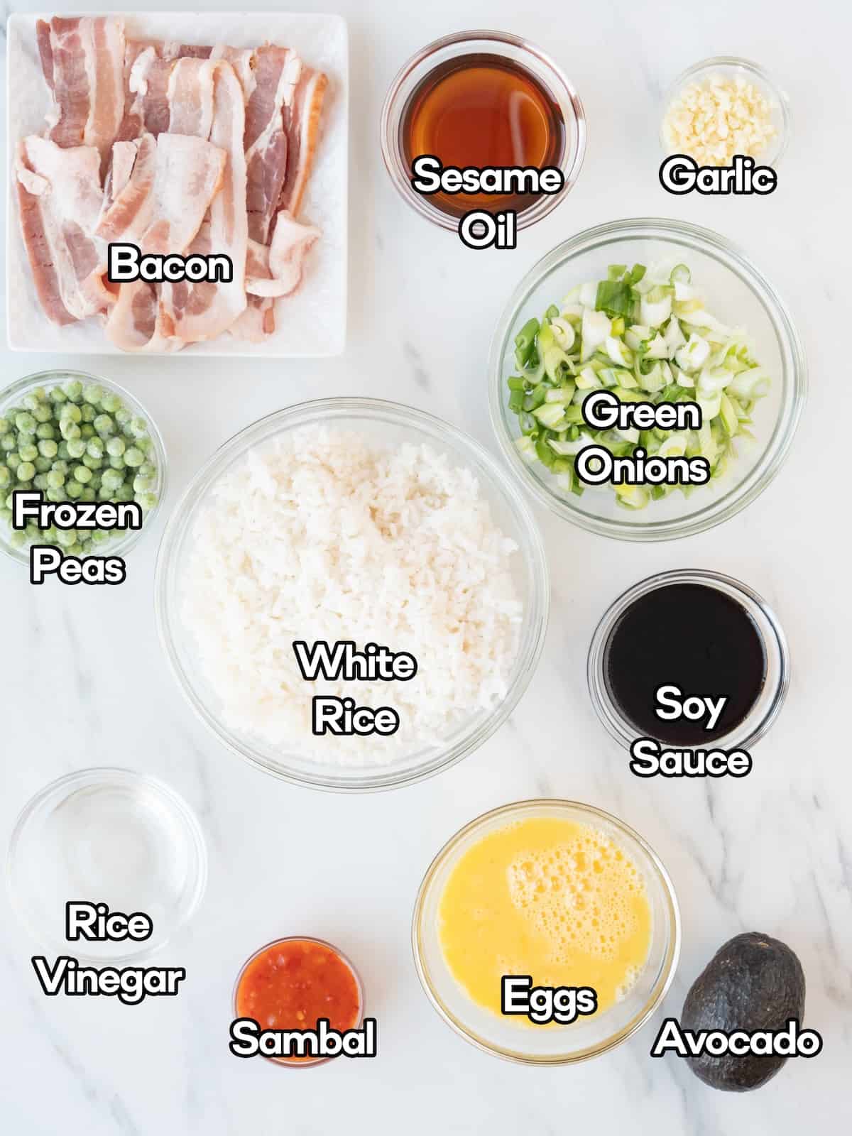 Mise-en-place of all the ingredients required to make spicy bacon fried rice.