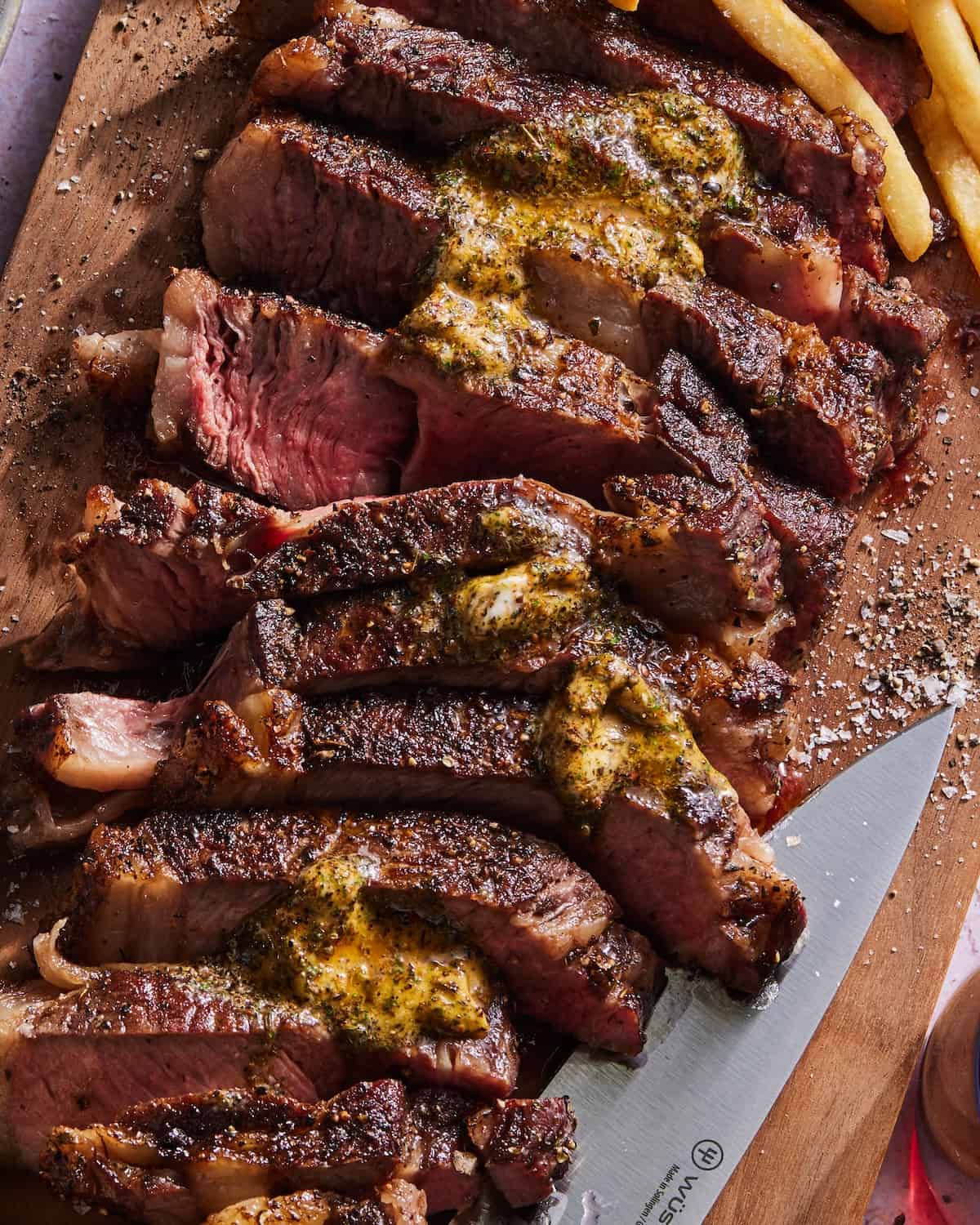 a close up of Chimichurri Steak and a herb compound butter