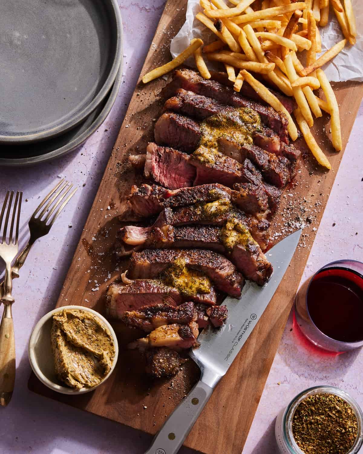 Chimichurri Steak (cooked via Reverse Sear) with a side of french fries and a herb compound butter